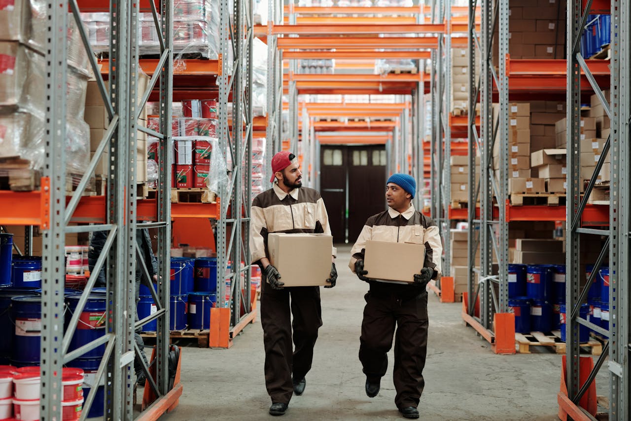 Efficient warehouse staff organizing and moving inventory packages in a large storage facility.