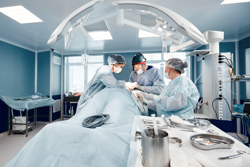 Detailed view of surgeons performing a complex operation in an advanced medical operating room.