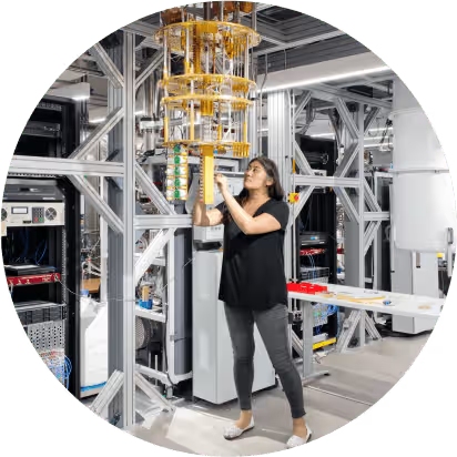 Woman working on quantum computer in research lab.