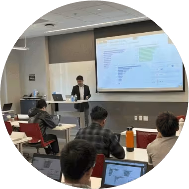 Academic researcher presenting data to students in a classroom setting.