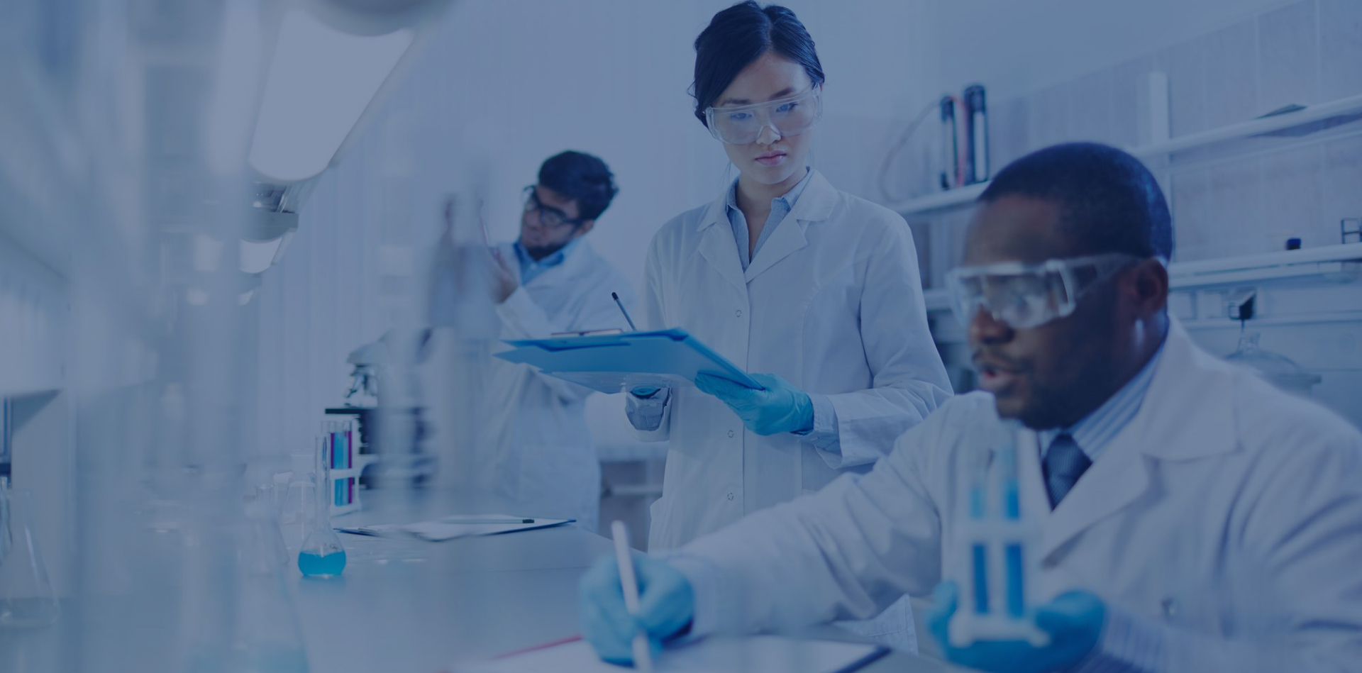 Laboratory scientists conducting research with safety gear on.