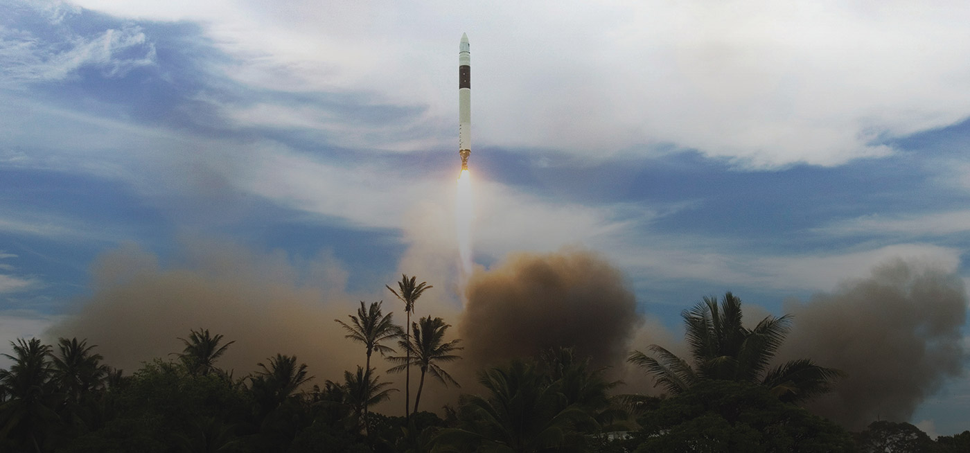 A rocket launches into the sky, leaving trails of smoke above tropical palm trees, symbolizing space exploration and scientific progress.