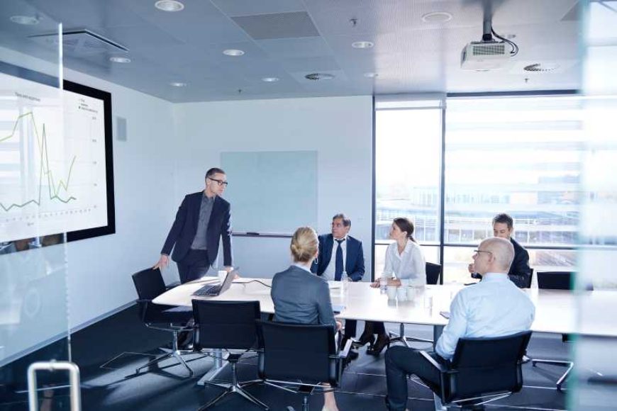 Highly detailed image of a professional business meeting with presentation slides in a modern office setting.