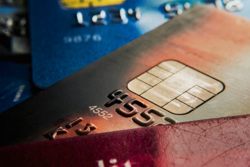 Credit card with chip and magnetic strip for secure transactions.