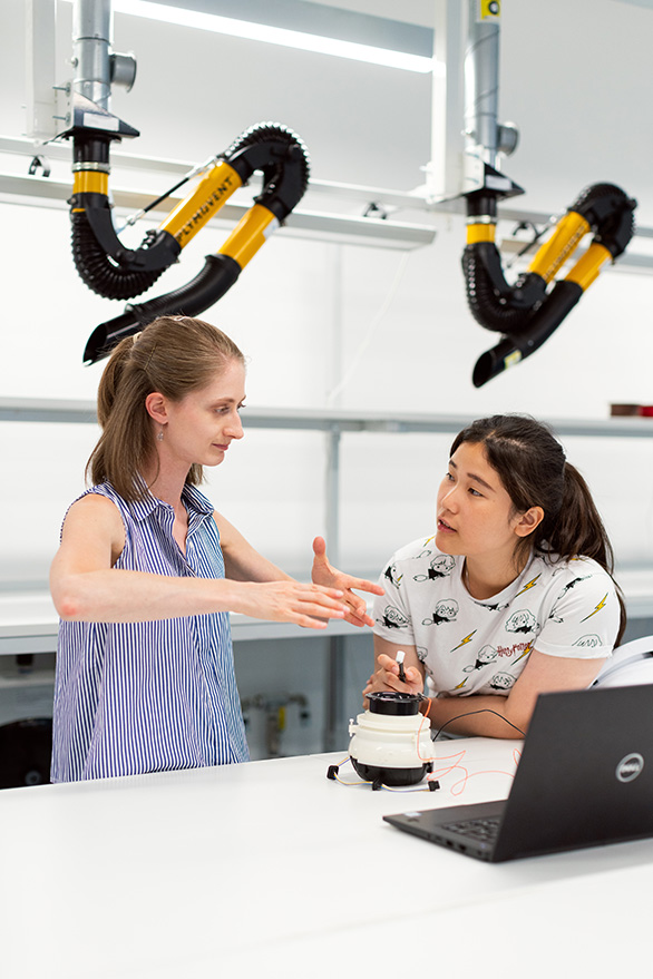 Robotics research in an industrial lab setting.
