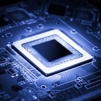 Close-up of a modern microprocessor integrated into a circuit board. Optimized for technology and electronics research.