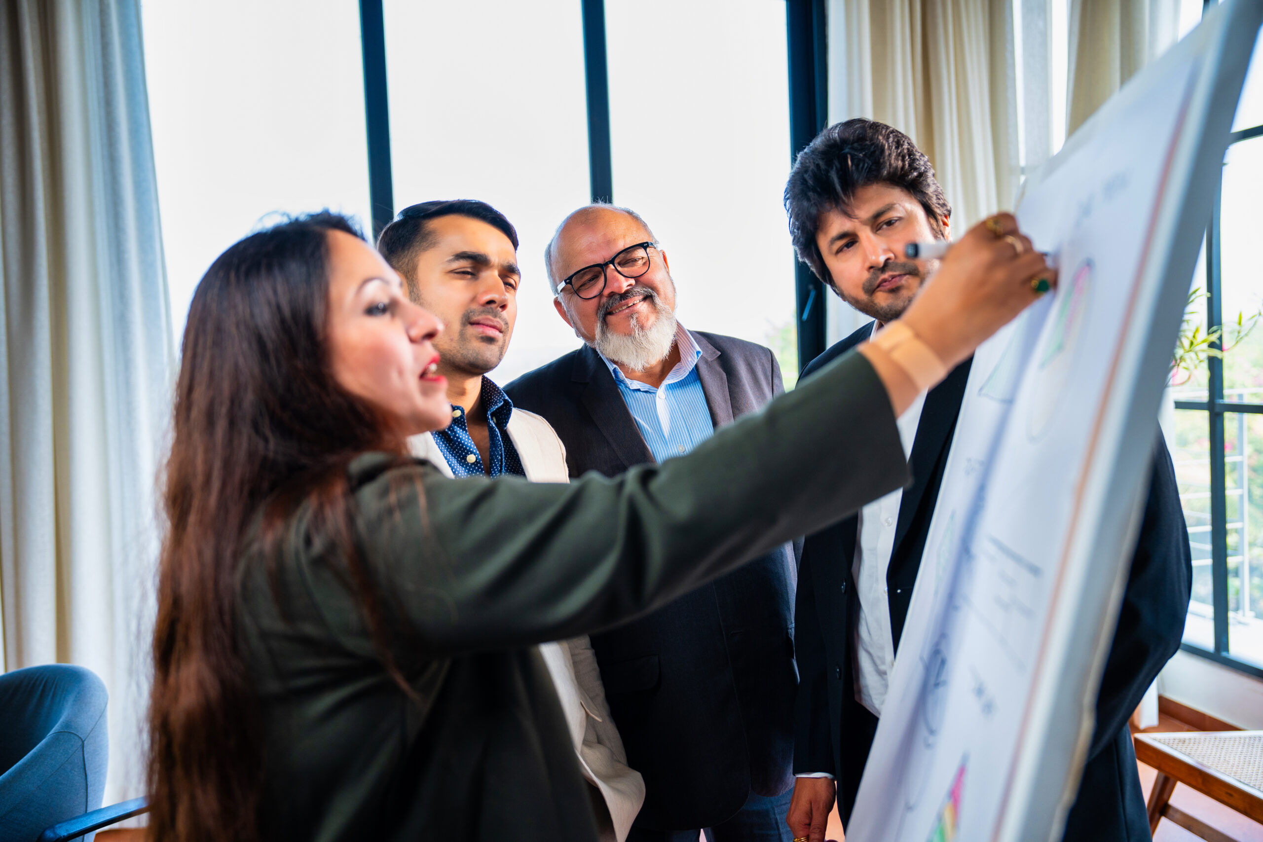 An academic team passionately discusses research findings during a professional conference on education and science.