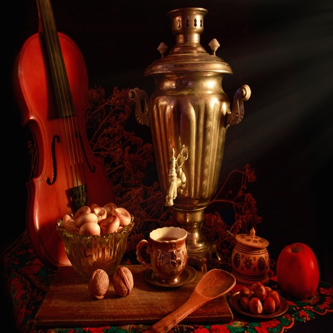 A traditional still-life scene with a samovar, violin, nuts, and fruit showcasing cultural and historical symbolism.