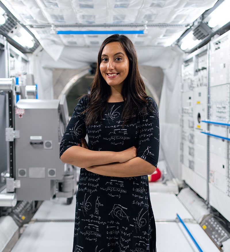 Astronaut woman in space lab research.